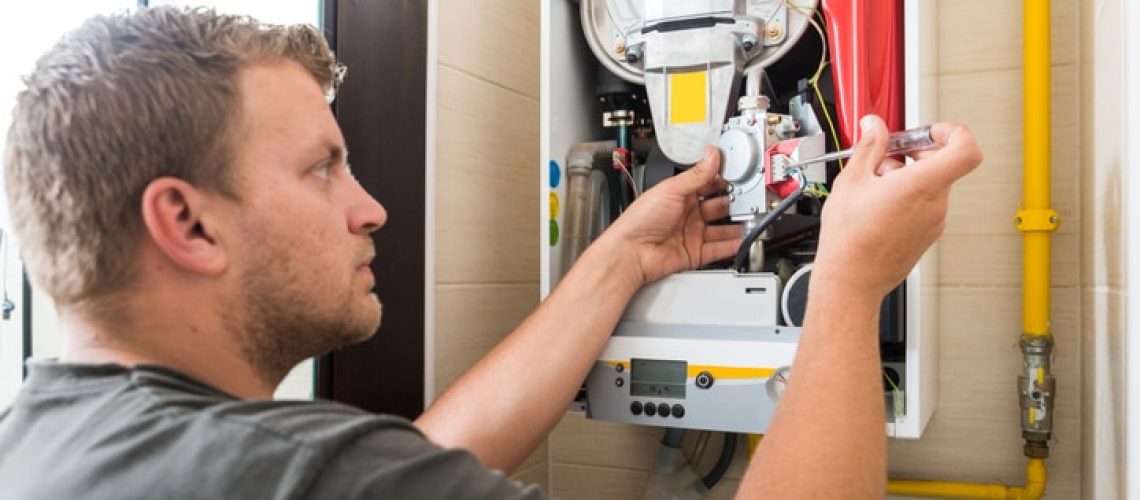 Technician repairing Gas Furnace